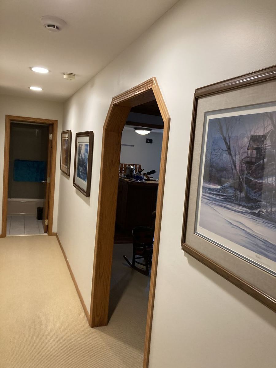 Hallway with an oak arch, walls finished white