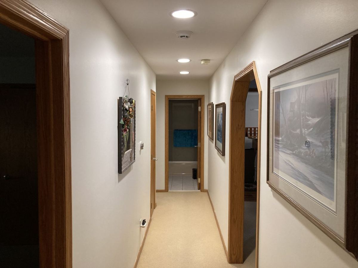 Long hallway finished white